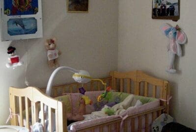 A crib with many toys in it
